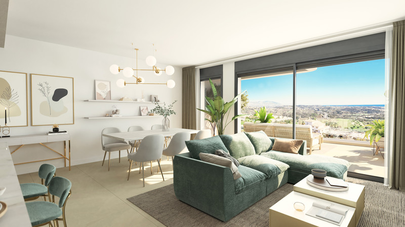 Calanova Collection – Mijas - lys åpen stue med grønn sofa, gulv-til-tak-vinduer og panoramautsikt mot kysten
