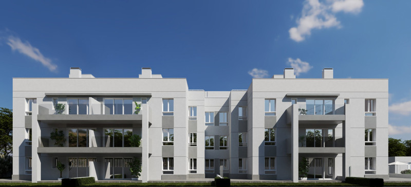 OCEANIC GARDEN – Mijas - modern white residential facade with spacious balconies and large glazed windows under blue sky