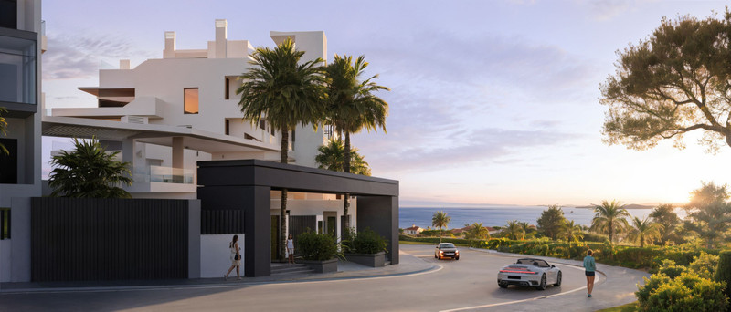 Rayos Del Sol – El Chaparral - modern luxury exterior facade at dusk with sea views, palm trees and gated entrance in Málaga