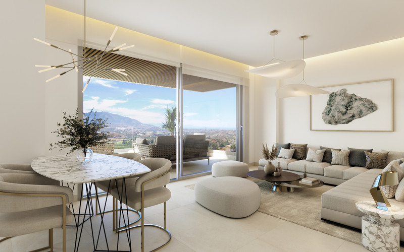 Sunrise Golf Residences - open-plan living and dining area with panoramic mountain and golf course views through floor-to-ceiling sliding doors
