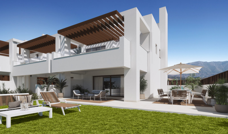 The Meadows – La Cala Golf - modern white exterior with garden, terrace, sun loungers and mountain backdrop