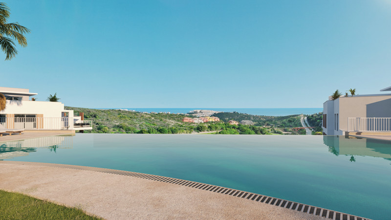 Abril Doña Julia – Casares - uendelighetsbasseng med panoramautsikt over hav og åser under klar blå himmel