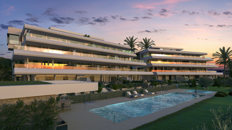 Absolute Estepona – Estepona - luxury modern residential building with illuminated balconies, pool and landscaped gardens at dusk