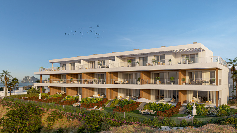 Alcaidesa Homes Phase II – La Alcaidesa - moderne trefløyet boligfasade med terrasser og velstelte hager