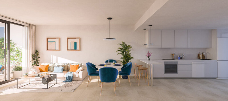 Altara Alcaidesa – La Alcaidesa - bright open-plan living, dining and kitchen area with blue velvet chairs and modern white cabinetry