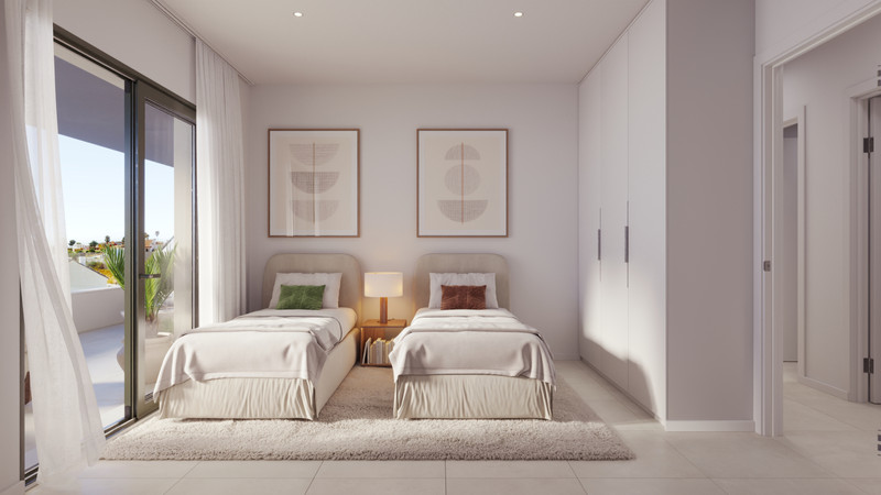 Astra Homes – Fuengirola - soverom med balkongadgang, hvite garderobeskap og abstrakt veggkunst