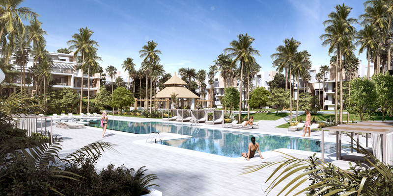 Ayana Estepona – New Golden Mile - luksuriøst utendørs basseng omgitt av palmer og moderne boligbygg