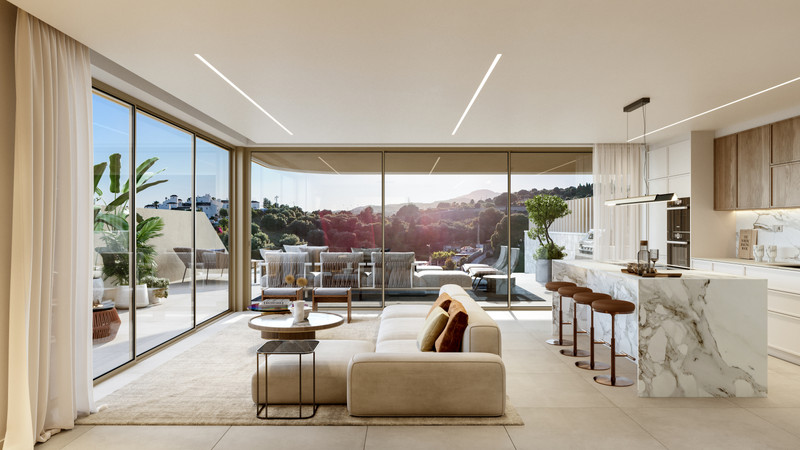 Beyond Homes – Estepona - åpen stue og kjøkken med marmorøy og panoramautsikt fra terrassen