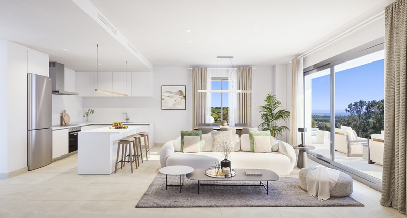 Birdie Hills – Estepona - åpen stue og kjøkken med hvite interiører og panoramautsikt fra terrassen