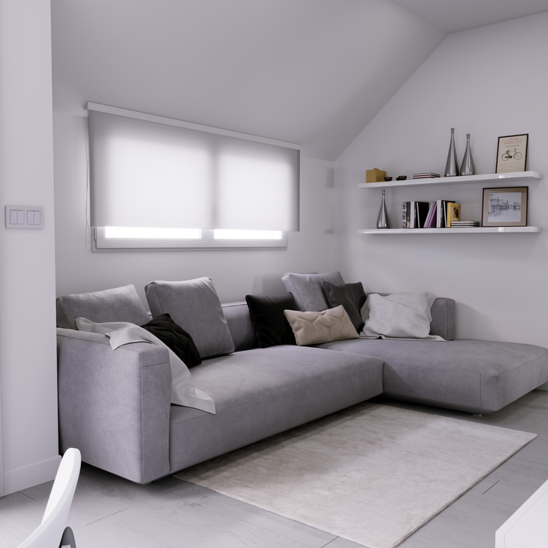 Edificio Perseo – Fuengirola - moderne grå hjørnesofa, pynteputer og vegghyller i lys stue