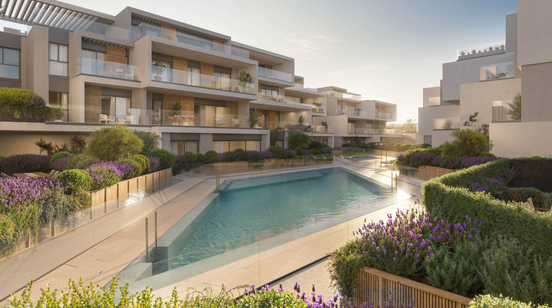 Isla Bela – Marbella - luxury residential complex with communal pool, terraced apartments and lavender gardens at golden hour