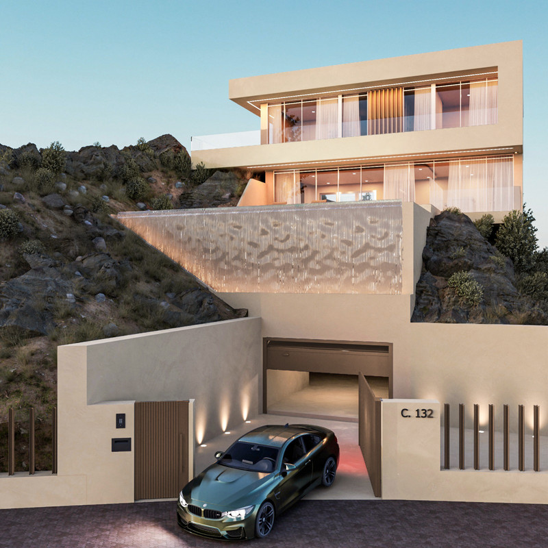 La Roca 2 – Benalmadena - eksklusiv moderne villa eksteriør med åslandskap, foss-vegg og BMW i forgrunnen i skumringen