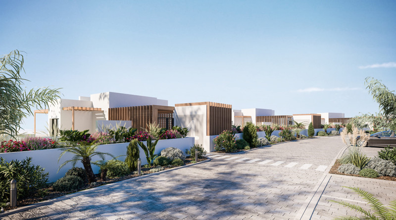 Mirador de Estepona Hills – Estepona - moderne hvite villaer med trespileskjermer og frodige middelhavshager langs en brolagt gate