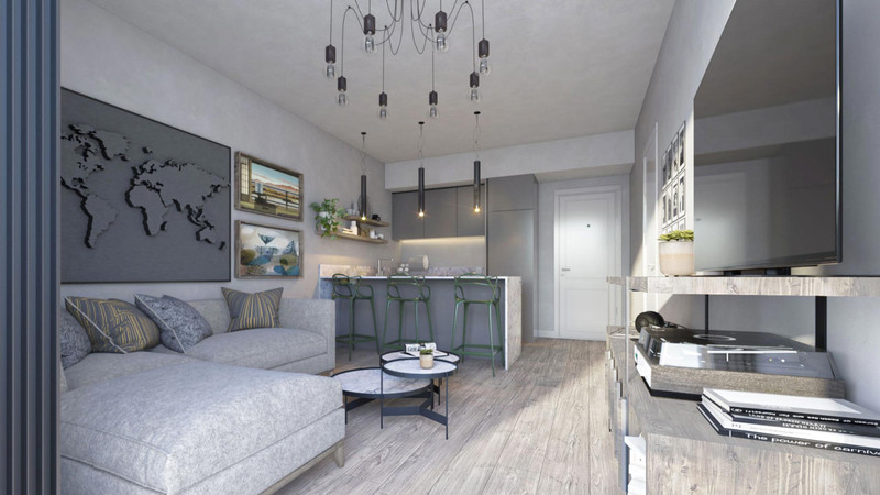 Premier Residencial – Las Lagunas - moderne åpen stue med grå sofa, kjøkkenbar og pendelbelysning
