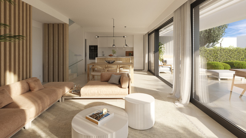 Serene Atalaya – Phase 1 – Atalaya - bright open-plan living and dining area with floor-to-ceiling glass doors opening to a sunny terrace
