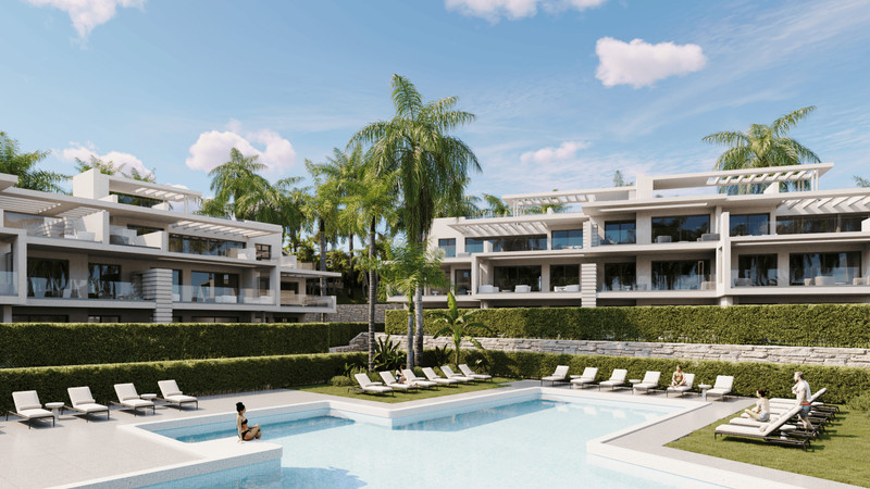 Sunway Residence – Estepona - luksusbasseng og solterrasse omgitt av moderne hvite leiligheter og tropiske palmetrær