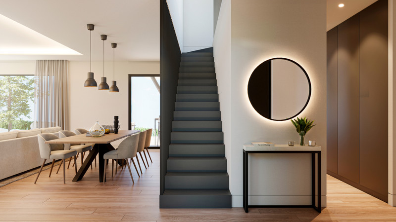 Villa Aitana – Mijas - moderne inngangsparti med rundt speil, belyst konsollbord og åpen trapp med utsikt til spisestue