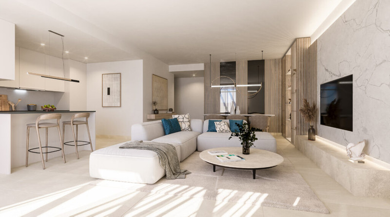 Zenith Estepona – Estepona - åpen stue og kjøkken med hvit hjørnesofa, marmorvegg og turkise detaljer