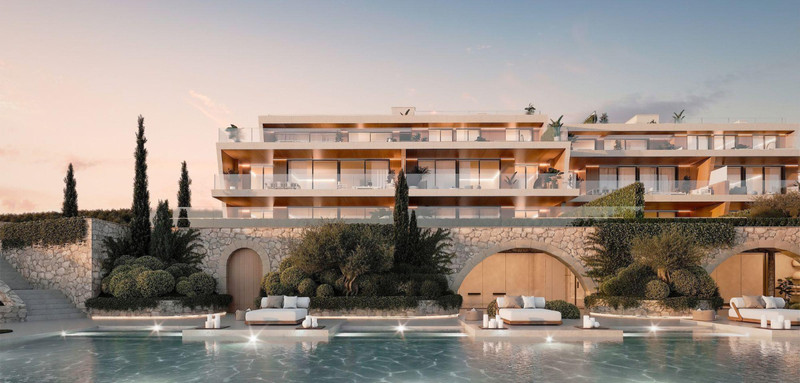 Amenábar Cortesín – Casares - luxury new-build exterior with pool, stone terraces, and illuminated façade at dusk