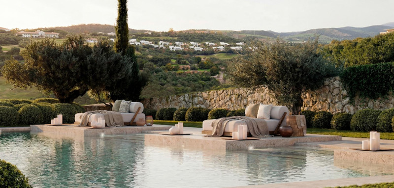 Amenábar Cortesín – Casares - luxury infinity pool terrace with sun loungers, candles, and rolling hillside views