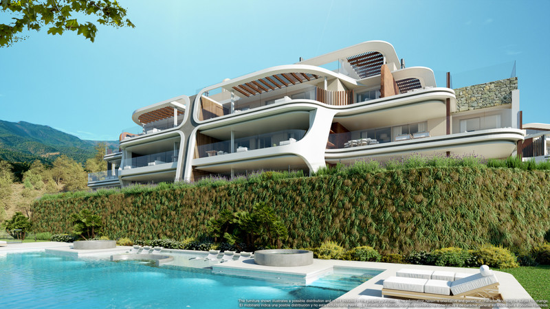 Enebros Fase 1 – Benahavís - luxury new-build exterior with curved white facades, terraces, and a shimmering outdoor pool surrounded by lush hedging and mountain views