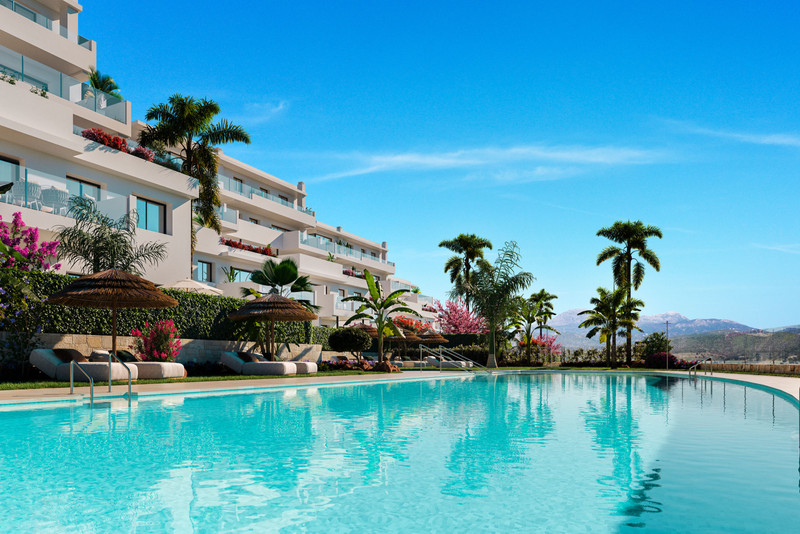 Las Terrazas de Cortesin Bon Air – Casares - luxury outdoor swimming pool with palm trees and white apartment facade