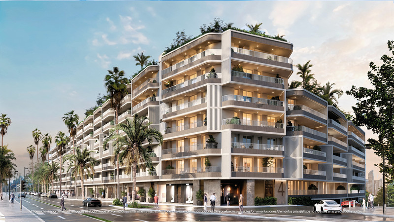 Magna Torremolinos II – Torremolinos - modern luxury residential facade with balconies and palm-lined boulevard at dusk