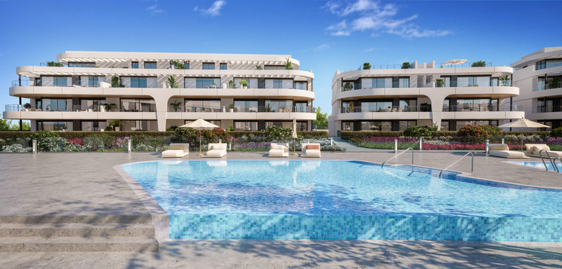 Naya Residences – Atalaya - luxury apartment complex exterior with communal pool, sun loungers and landscaped gardens in Málaga