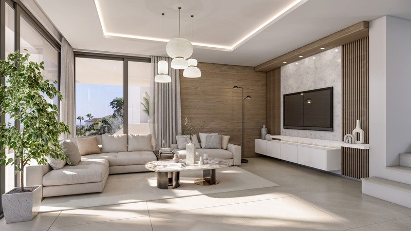 VILLA EVANIA Selwo – Estepona - bright open-plan living room with marble coffee table, sectional sofa and large-screen TV wall