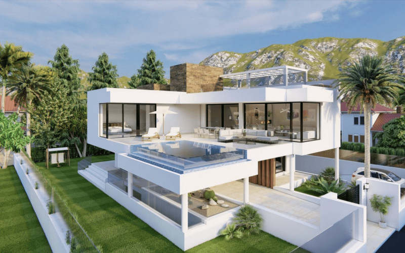 Villa 001 Marbesa – Marbella - modern white exterior with infinity pool, terraces, and mountain backdrop