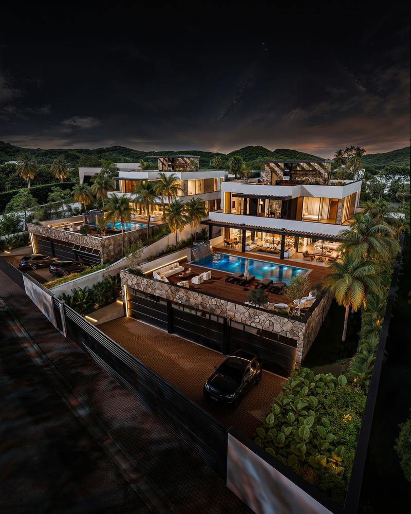 Manzanilla 12 – New Golden Mile - aerial night view of luxury villa with illuminated pool, terrace, and tropical gardens