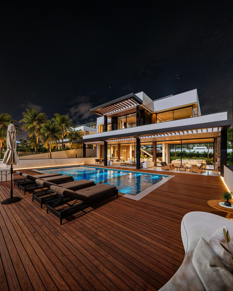 Manzanilla 12 – New Golden Mile - luxury villa exterior with illuminated pool and hardwood deck at night