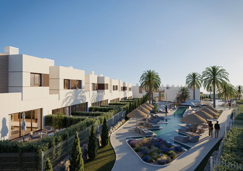 Savia – Fase 1 – Mijas - modern white townhouses with a lagoon-style pool, sun loungers, thatched umbrellas and tropical palm trees