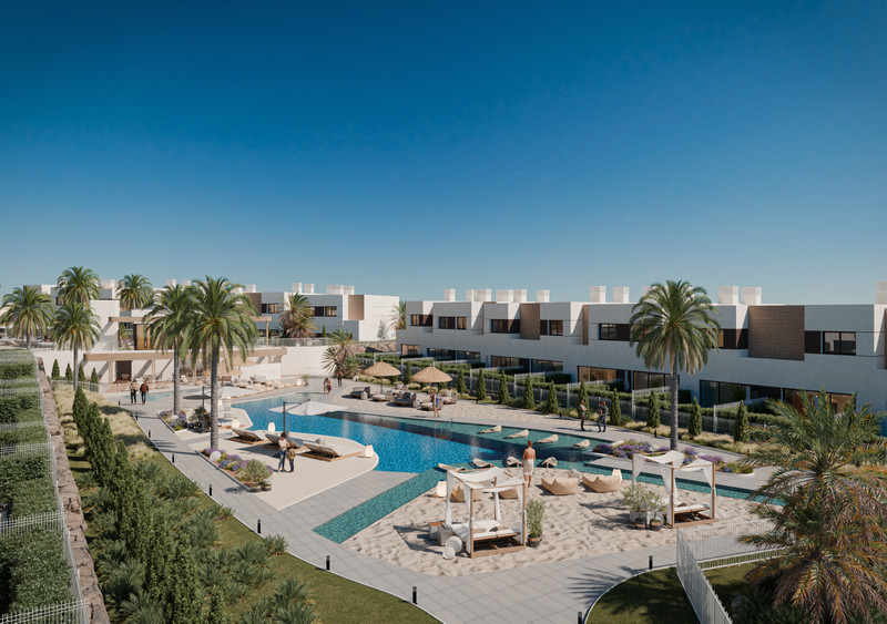 Savia – Fase 2 – Mijas - aerial view of communal pool, sandy chill-out area and modern white townhouses surrounded by palm trees