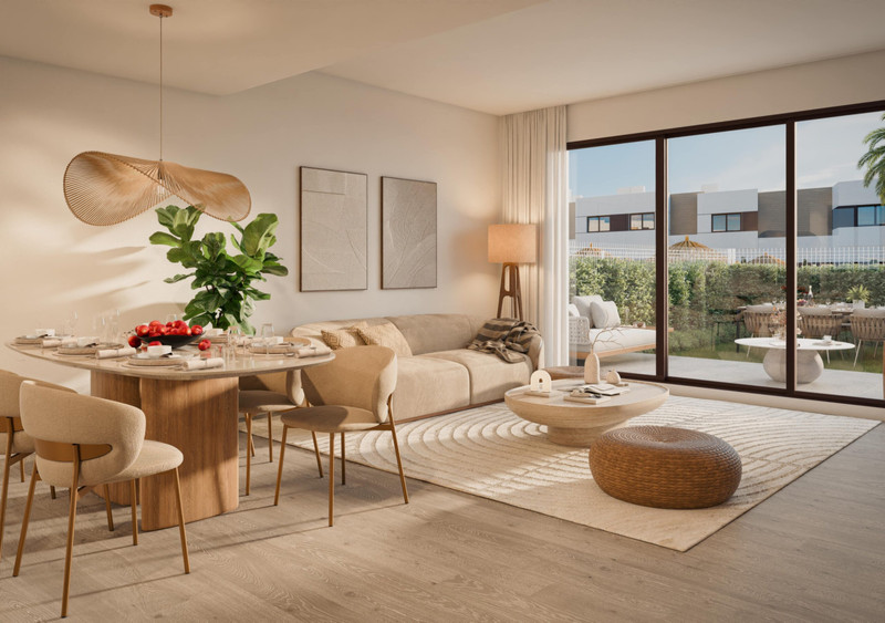 Savia – Fase 2 – Mijas - bright open-plan living and dining area with large sliding doors opening to a private garden