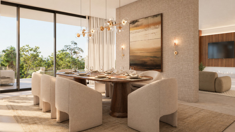 Stupa – Villa Prana – Benahavís - elegant dining room with oval walnut table, cream upholstered chairs and floor-to-ceiling glazing overlooking lush greenery