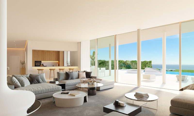 The Bay 7 – Benalmadena - open-plan living room with floor-to-ceiling glass doors, terrace, infinity pool and sea views