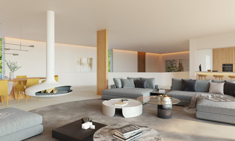 The Bay 7 – Benalmadena - open-plan living room with suspended fireplace, grey sectional sofa, and dining area