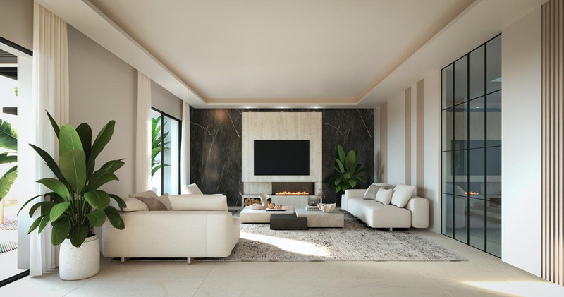 Villa Benalmadena – Benalmadena - åpen luksusstue med marmorvegg, peis og kremfargede sofaer