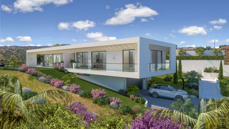 Villa Celestia – La Cala Golf - modern white exterior facade with landscaped garden, glass balustrades and mountain views