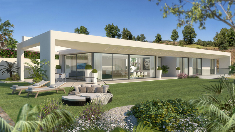 Villa Celestia – La Cala Golf - modern white villa exterior with glass facade, lush garden, and outdoor lounge seating
