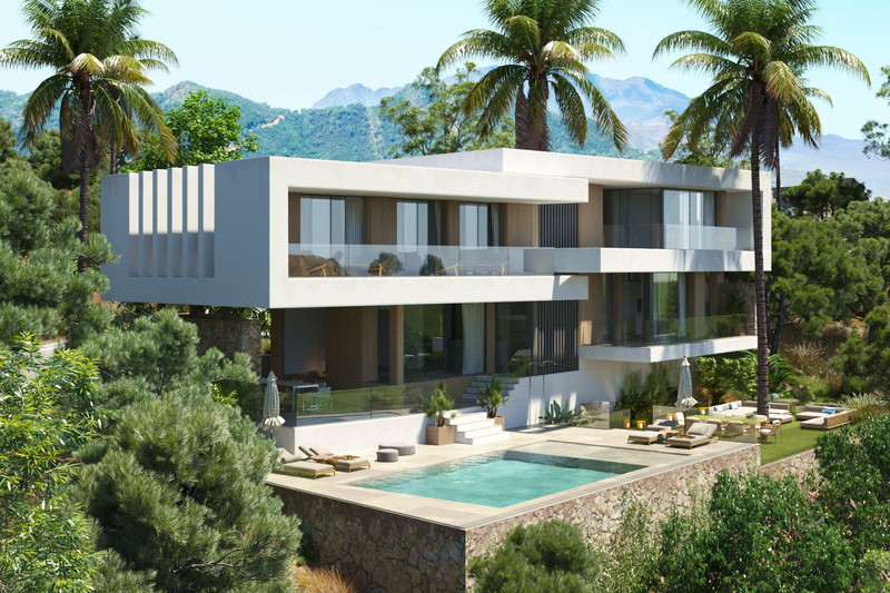 Villa Lyra – Benahavís - moderne hvit toetasjes villa med infinitybasseng, palmetrær og fjell i bakgrunnen